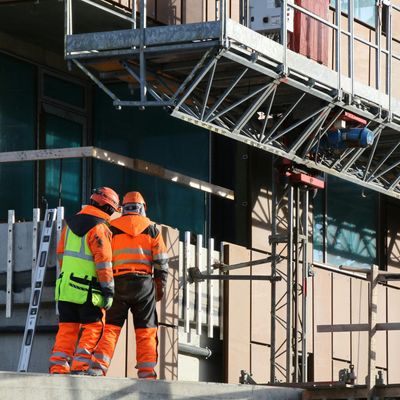 Two workers at a construction site in the Dallas-Forth Worth area