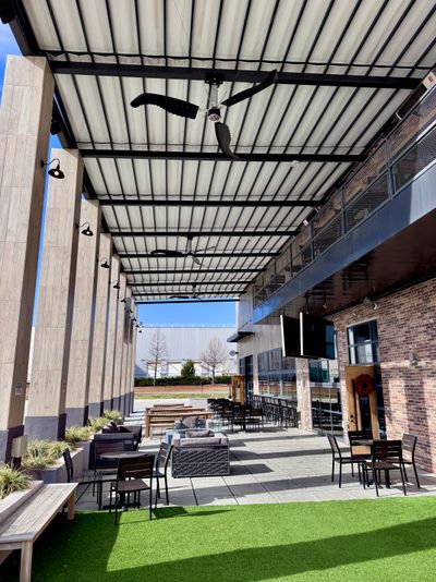 Super Duty industrial fans installed above the Three Wide Brewing outdoor patio
