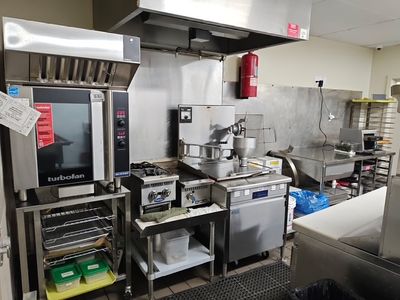 Super Duty industrial fans installed above the Three Wide Brewing outdoor patio