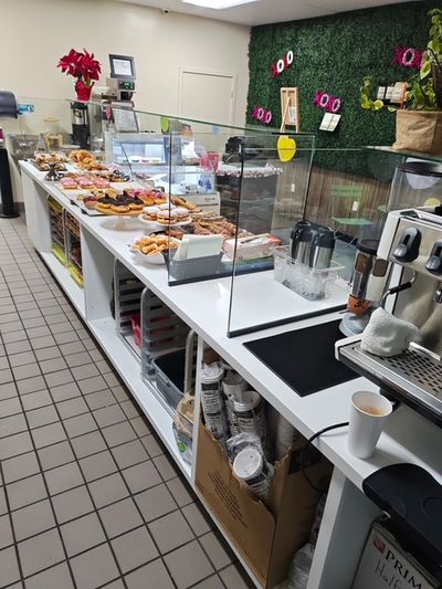 Custom red cabinetry installed by Benchmark One General Contracting