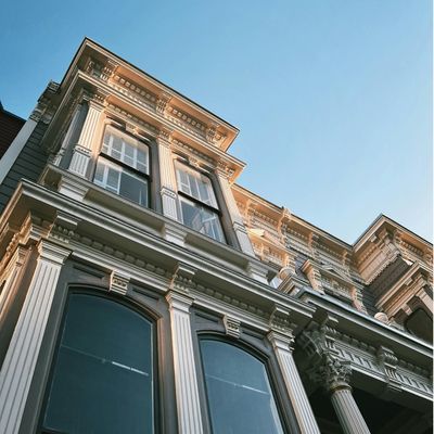 Building exterior with custom wooden millwork framing