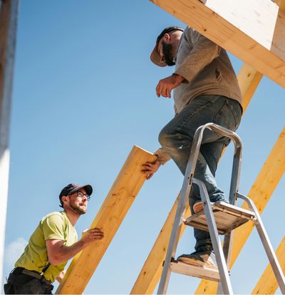 Benchmark One General Contracting team setting up wooden framing at construction site