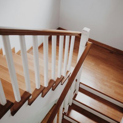 Second story addition with wooden stairs and railing