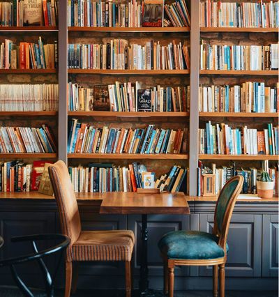 Cafe with bookshelves produced by Benchmark One General Contracting